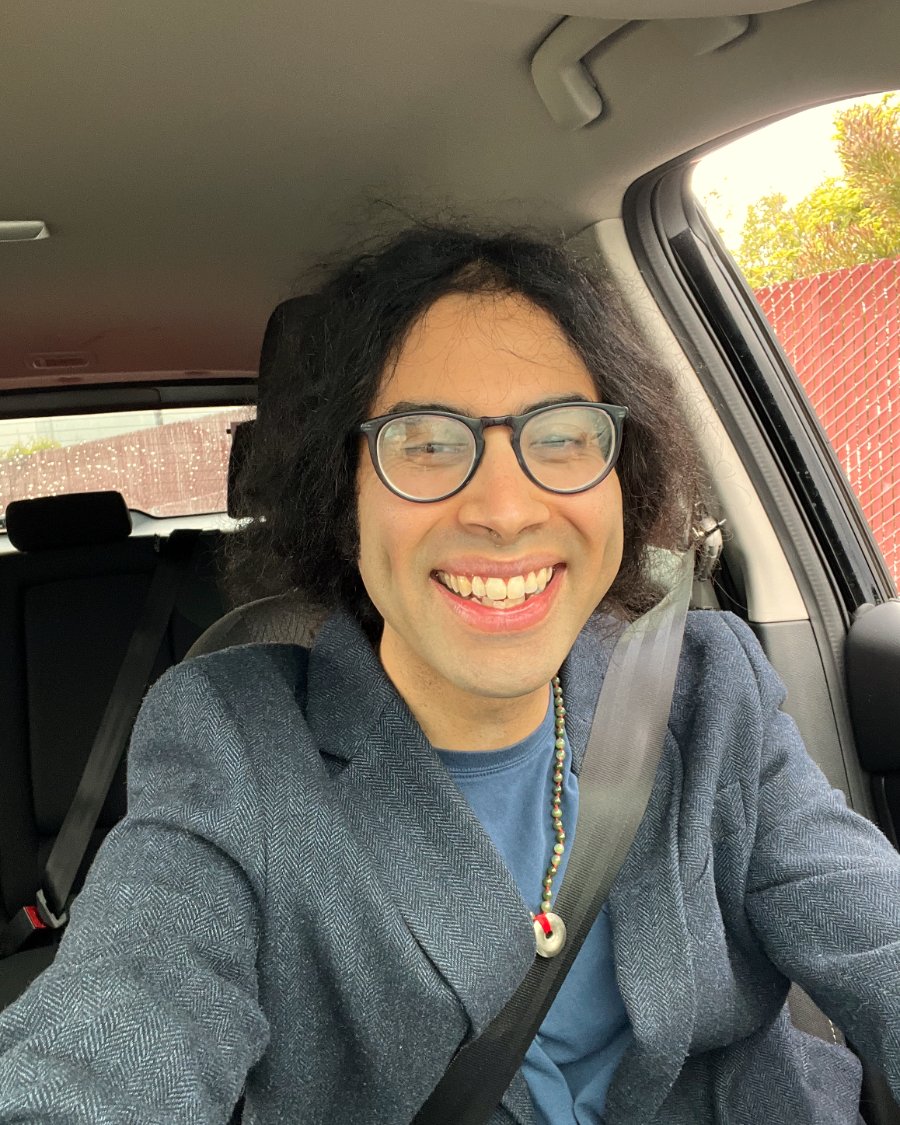 Christopher, founder of FullStop, smiling in the driver's seat